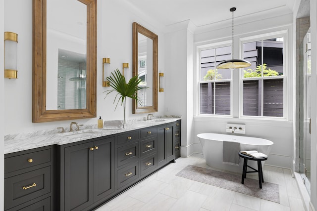 bathroom featuring ornamental molding, vanity, and plus walk in shower