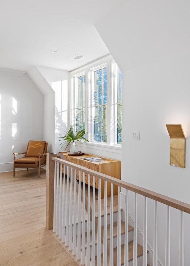 hall with light hardwood / wood-style floors