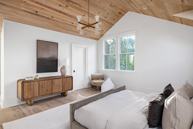 bedroom with wood ceiling, vaulted ceiling, and light hardwood / wood-style floors