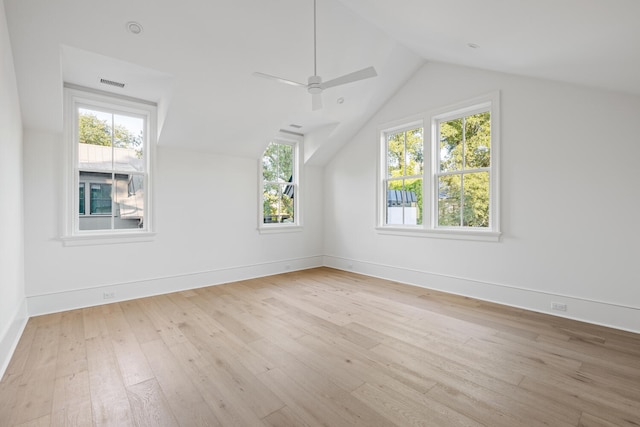 additional living space featuring lofted ceiling, light hardwood / wood-style floors, and ceiling fan