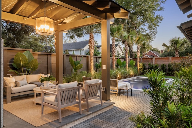 patio terrace at dusk with a gazebo and an outdoor hangout area