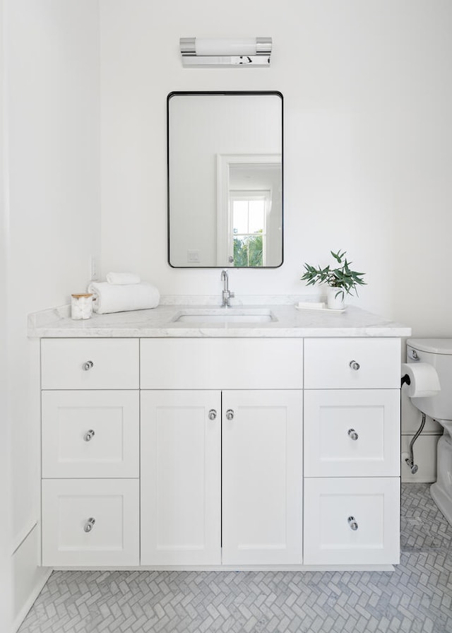 bathroom with vanity and toilet