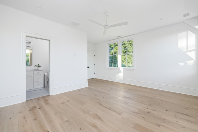 unfurnished bedroom with ensuite bath, light hardwood / wood-style flooring, and ceiling fan