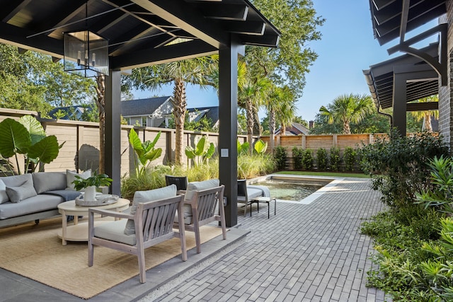 view of patio / terrace featuring a fenced in pool and outdoor lounge area