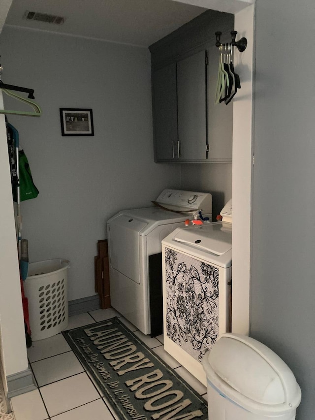 washroom with light tile patterned flooring and washer and clothes dryer