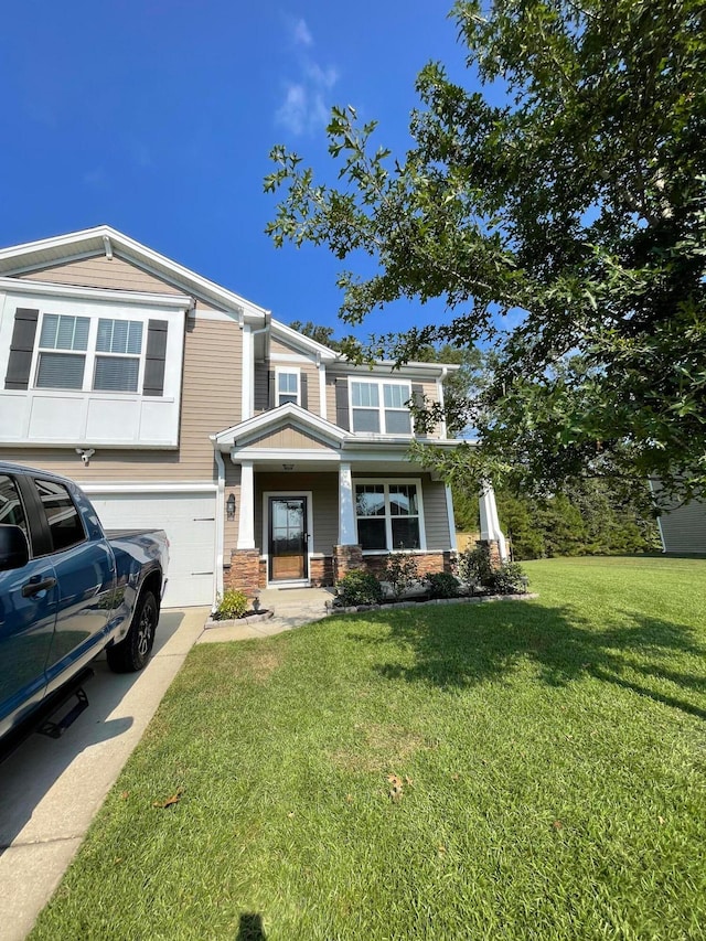 view of front facade with a front lawn and a garage