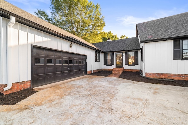 view of side of home with a garage