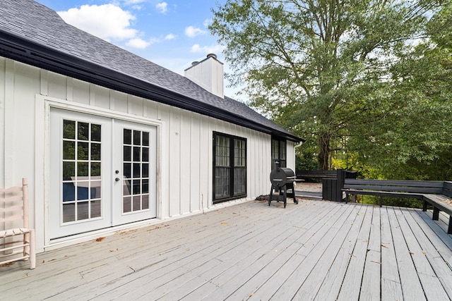 wooden terrace with french doors and a grill