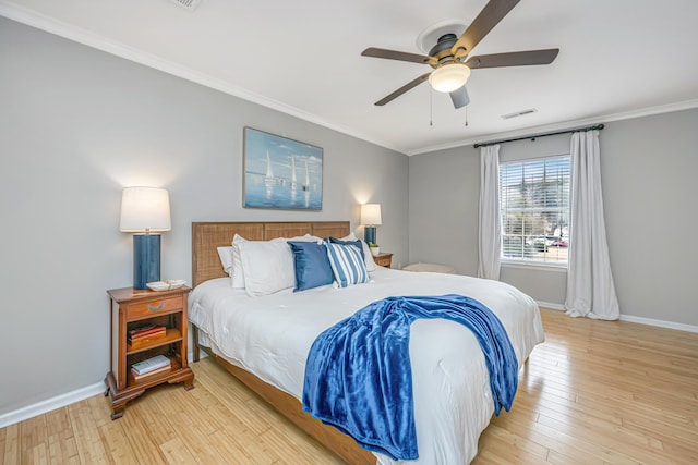 bedroom with ornamental molding, light hardwood / wood-style floors, and ceiling fan