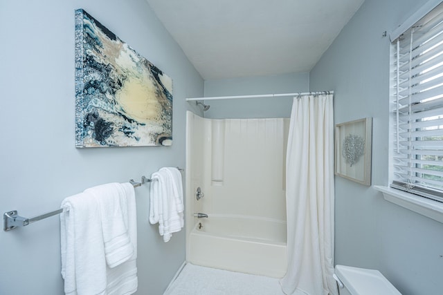 bathroom with shower / bath combo with shower curtain