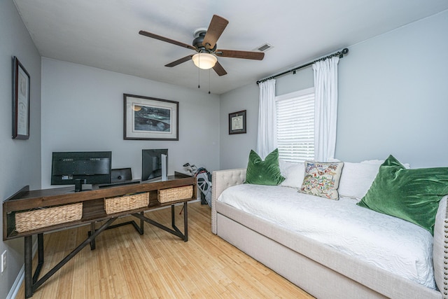 office space with wood-type flooring and ceiling fan