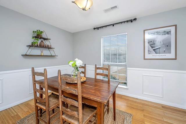 dining space featuring hardwood / wood-style flooring