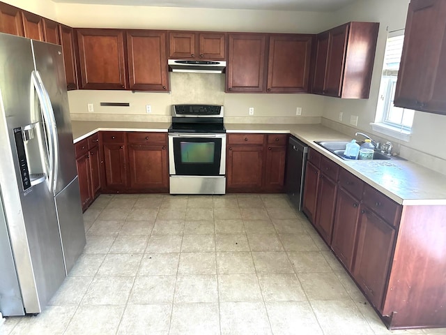 kitchen with sink, appliances with stainless steel finishes, and light tile patterned flooring