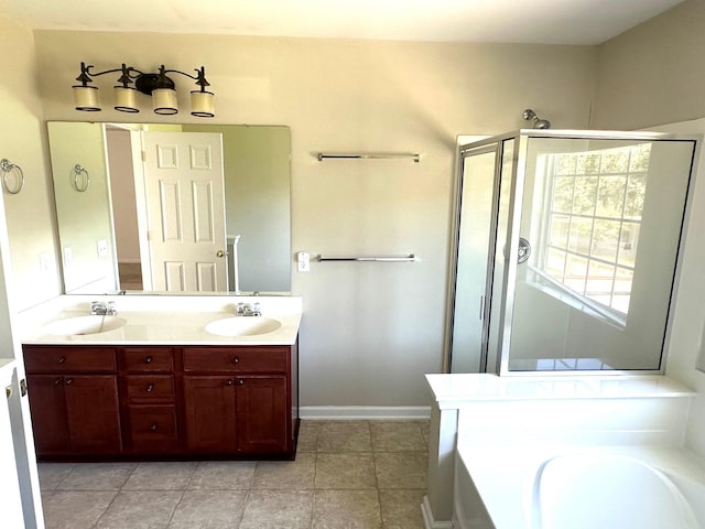 bathroom with a garden tub, double vanity, a sink, and a shower stall