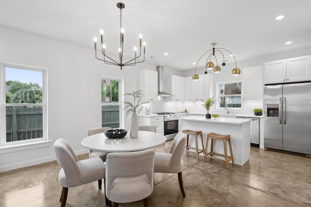 42 Poinsett St Unit B, Charleston, SC 29403 - dining area featuring finished concrete floors, a chandelier, plenty of natural light, and recessed lighting