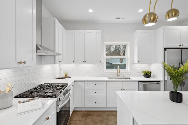 42 Poinsett St Unit B, Charleston, SC 29403 - kitchen featuring appliances with stainless steel finishes, a sink, light countertops, white cabinets, and recessed lighting