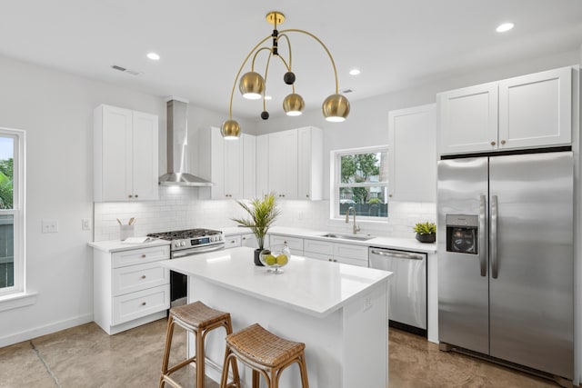 42 Poinsett St Unit B, Charleston, SC 29403 - kitchen featuring appliances with stainless steel finishes, wall chimney range hood, a sink, backsplash, and recessed lighting