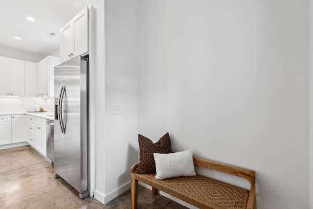 42 Poinsett St Unit B, Charleston, SC 29403 - kitchen featuring stainless steel appliances, white cabinets, tasteful backsplash, light countertops, and recessed lighting