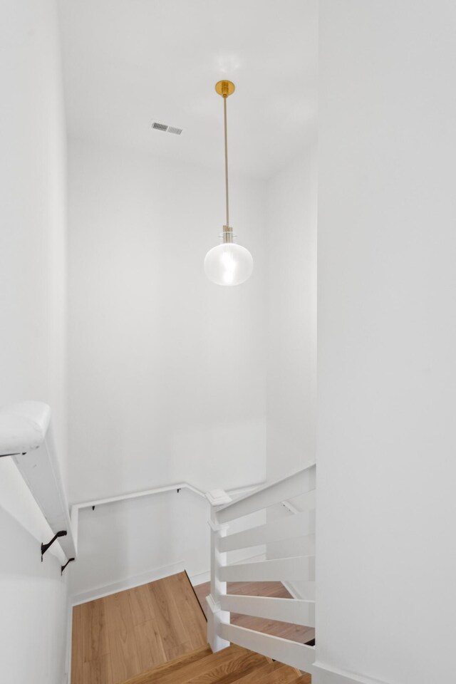 42 Poinsett St Unit B, Charleston, SC 29403 - staircase featuring wood finished floors and baseboards