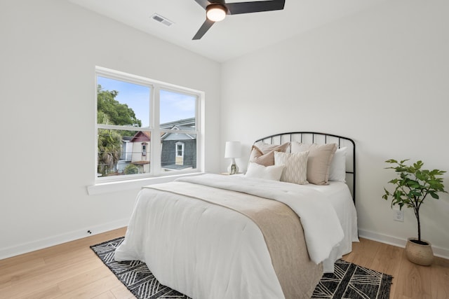 42 Poinsett St Unit B, Charleston, SC 29403 - bedroom with wood finished floors, baseboards, and ceiling fan