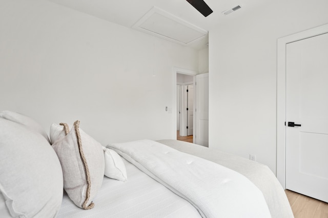 42 Poinsett St Unit B, Charleston, SC 29403 - bedroom featuring light wood-type flooring, attic access, and ceiling fan