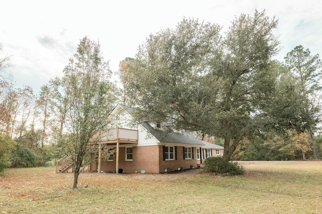 view of side of home featuring a lawn