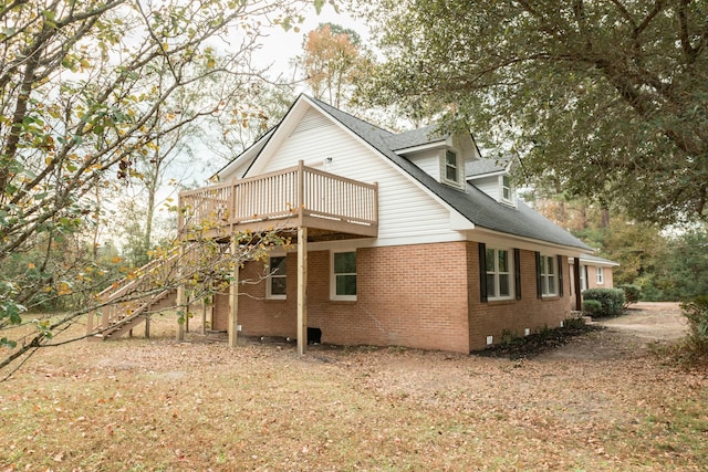 back of property featuring a deck