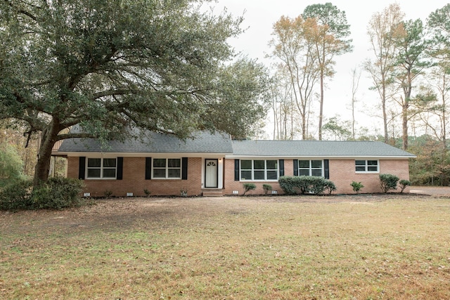 ranch-style house with a front lawn