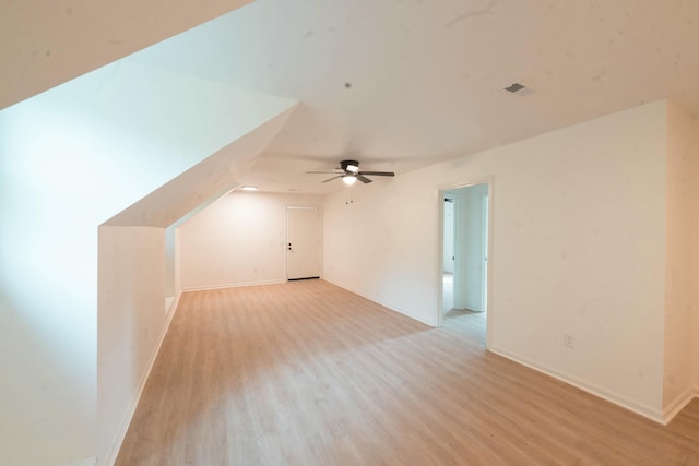 bonus room with ceiling fan, light wood-type flooring, and vaulted ceiling