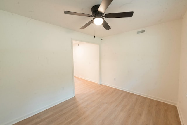 unfurnished room featuring light hardwood / wood-style flooring and ceiling fan