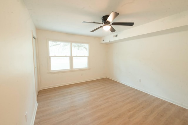 unfurnished room featuring ceiling fan and light hardwood / wood-style flooring