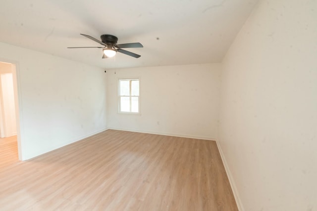 unfurnished room with light wood-type flooring and ceiling fan