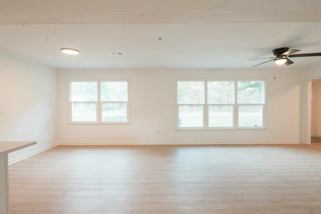 spare room with ceiling fan and light hardwood / wood-style flooring