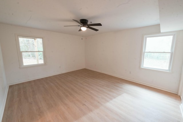 spare room featuring ceiling fan and light hardwood / wood-style floors