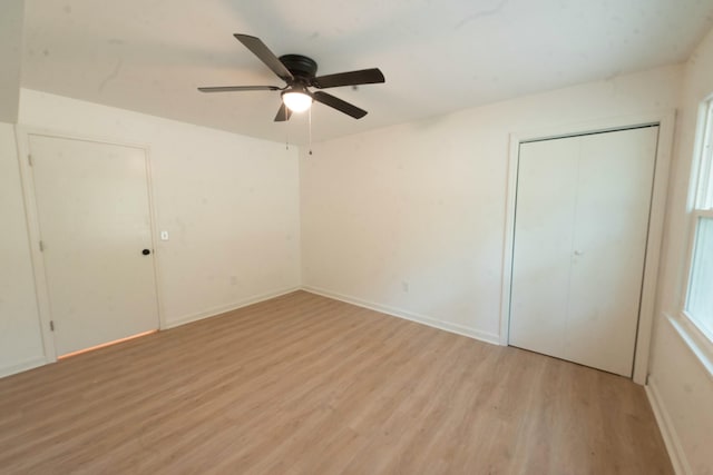 unfurnished bedroom with a closet, ceiling fan, and light hardwood / wood-style flooring