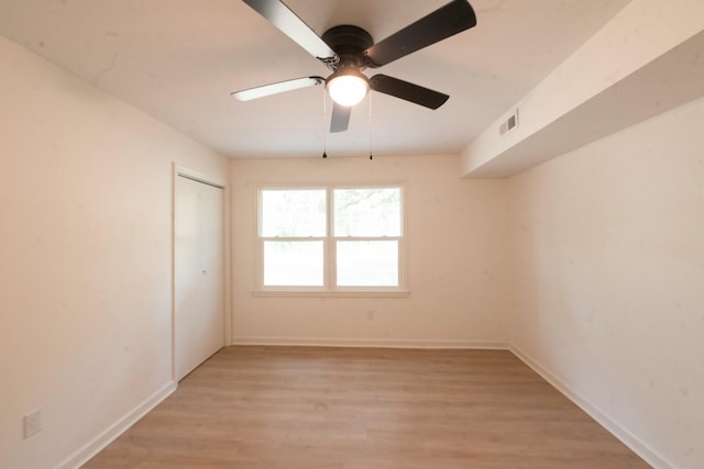 unfurnished room featuring ceiling fan and light hardwood / wood-style floors