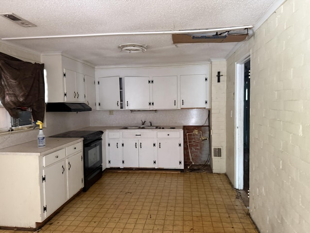 kitchen with black electric range oven, light floors, white cabinets, under cabinet range hood, and visible vents