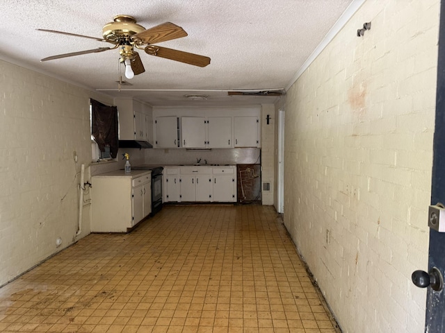 kitchen with white cabinets, light floors, light countertops, black range with electric cooktop, and ceiling fan
