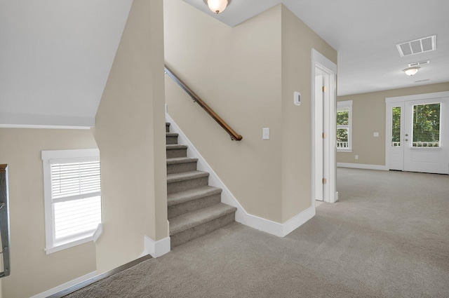 stairs with carpet floors