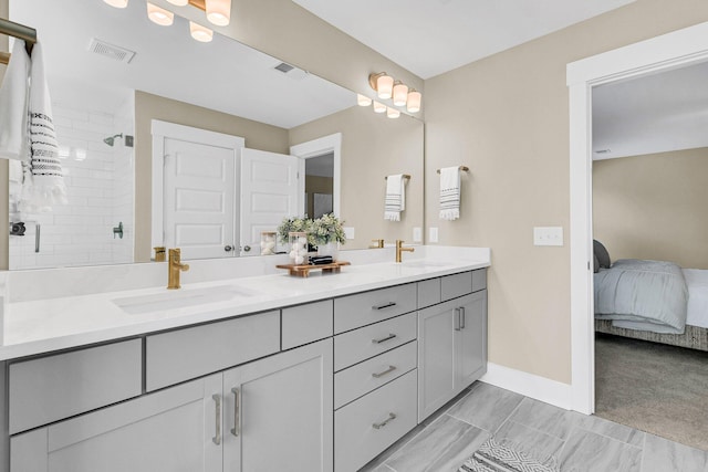 bathroom featuring vanity and an enclosed shower