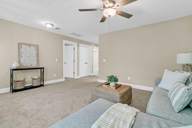 carpeted living room featuring ceiling fan