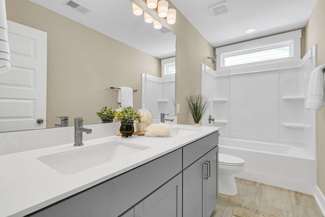 full bathroom with vanity, toilet, and shower / bath combination