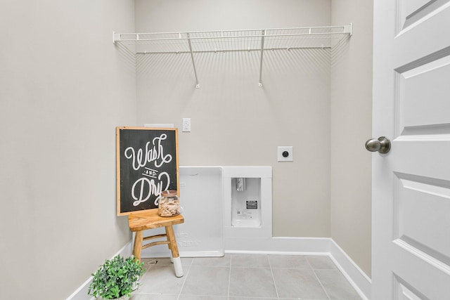 laundry room featuring light tile patterned floors and electric dryer hookup