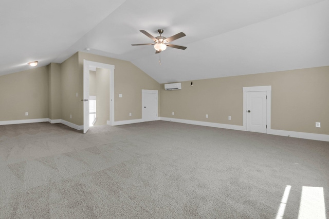 bonus room with ceiling fan, light carpet, vaulted ceiling, and an AC wall unit