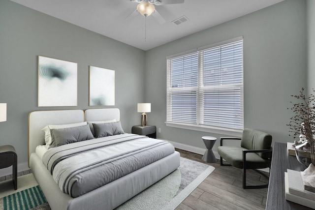 bedroom with hardwood / wood-style flooring and ceiling fan