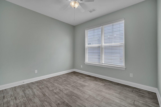 spare room featuring ceiling fan and light wood-type flooring