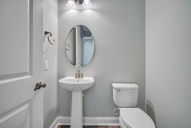 bathroom with sink and toilet