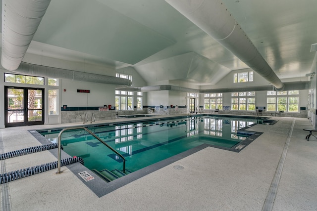 view of pool with french doors