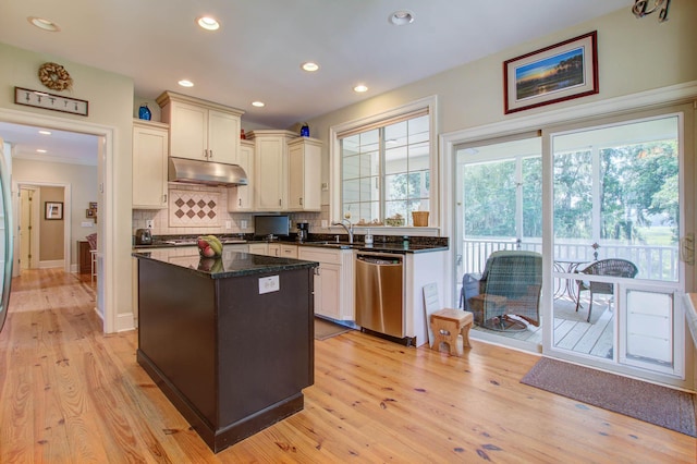 kitchen featuring stainless steel dishwasher, tasteful backsplash, light wood-style flooring, under cabinet range hood, and recessed lighting