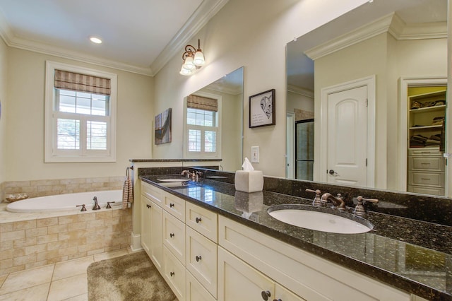bathroom with crown molding, a stall shower, a bath, tile patterned floors, and double vanity